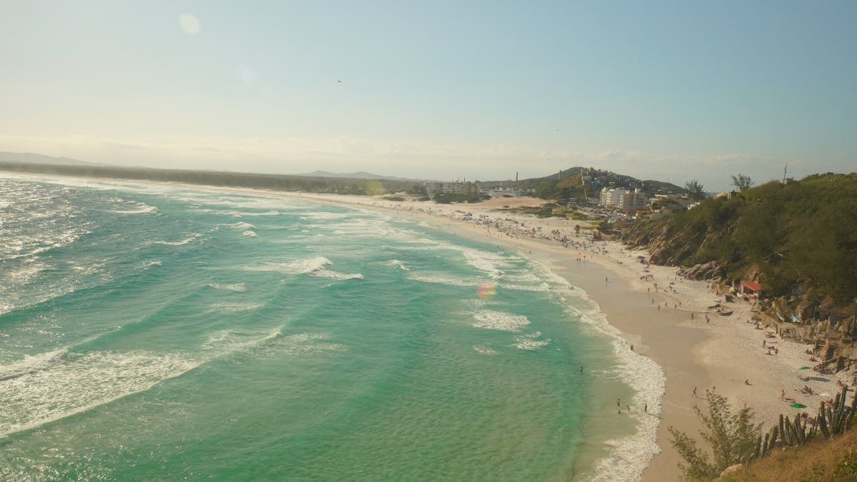 A breathtaking view of Praia Grande beach in Arraial do Cabo, Brazil, showcasing turquoise waters and sandy shores.